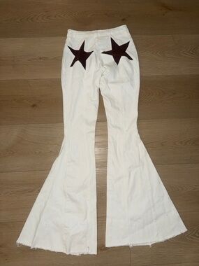 Fashion Nova White Flare Pants with Dark Star Back Accents